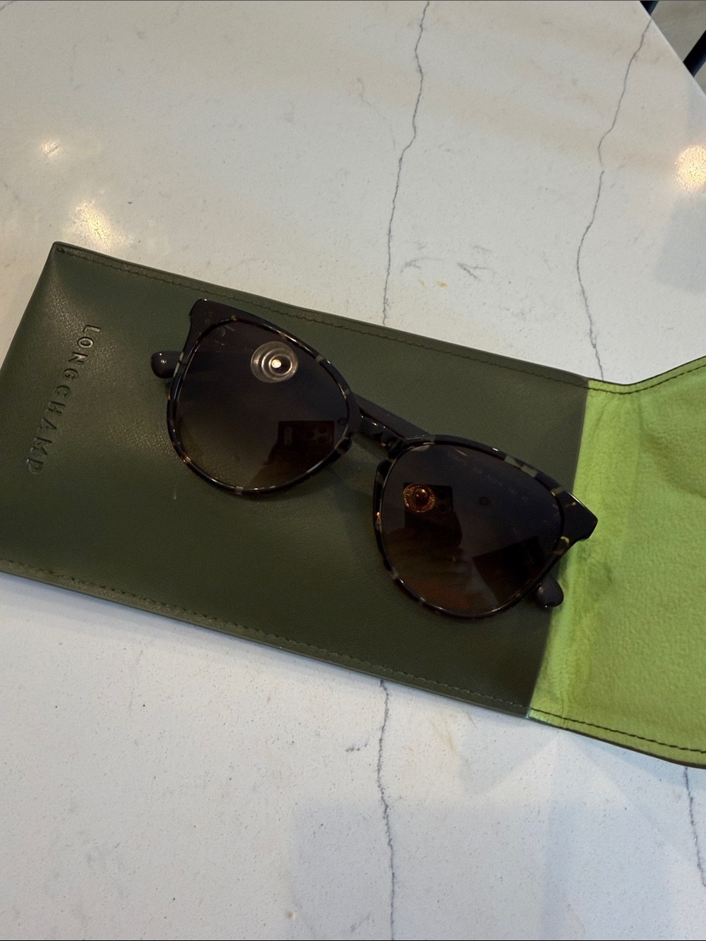 Longchamp tortoise shell sunglasses w/ Olive Green Leather Sleeve